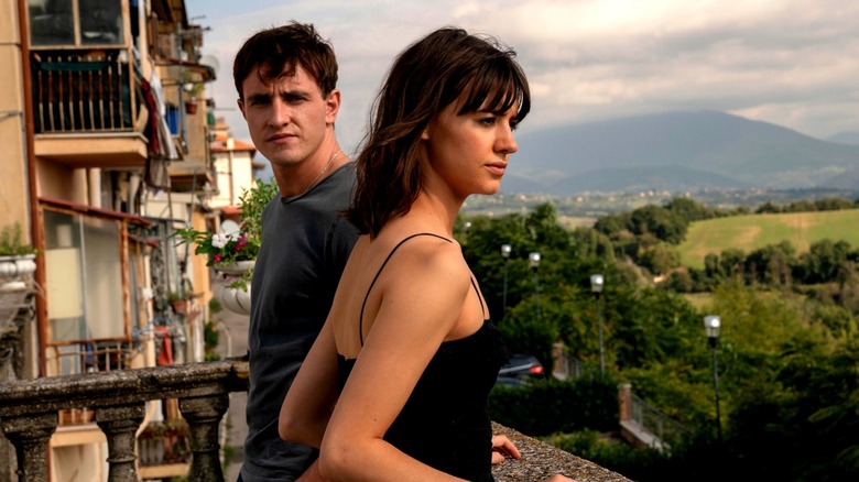 Connell looking at Marianne on a balcony in Normal People