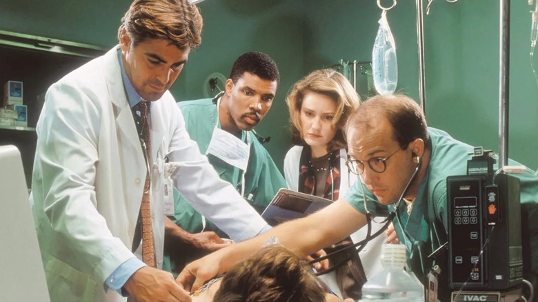 Doug Peter Susan and Mark treating a patient on ER