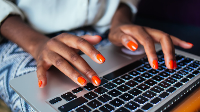 Woman's hands with press-on nails