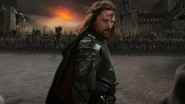 Viggo Mortensen as Aragorn standing in front of an army in The Lord of the Rings: The Return of the King