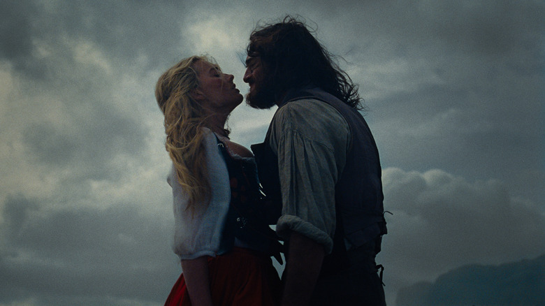 Margot Robbie as Cathy being confronted by Jacob Elordi as Heathcliff in Wuthering Heights (2026)