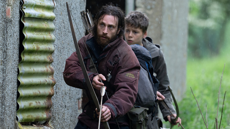Aaron Taylor-Johnson as Jamie and Alfie Williams as Spike looking nervous in 28 Years Later