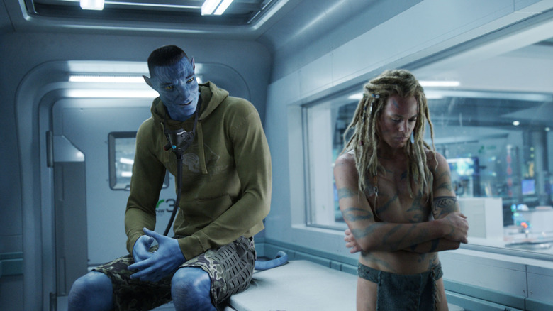 Stephen Lang as Quaritch speaking with Jack Champion as Spider in the lab in Avatar: Fire and Ash