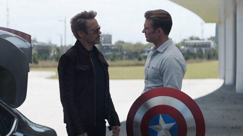 Robert Downey Jr. as Tony Stark giving a new shield to Chris Evans as Steve Rogers in Avengers: Endgame
