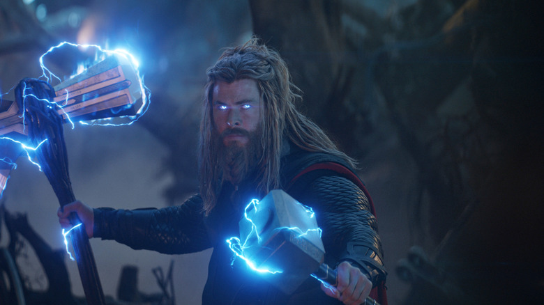 Chris Hemsworth as Thor lighting up Stormbreaker and Mjolnir in Avengers: Endgame