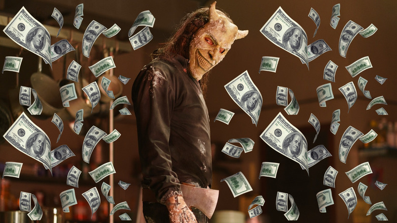 The Grabber surrounded by money in Black Phone 2