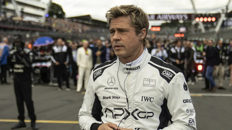 Brad Pitt as Sonny Hayes staring at the track in F1: The Movie
