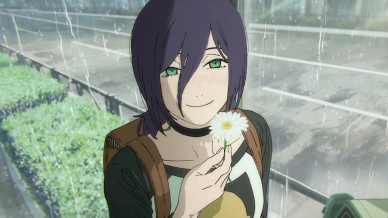 Reze holding up a flower in Chainsaw Man - The Movie: Reze Arc