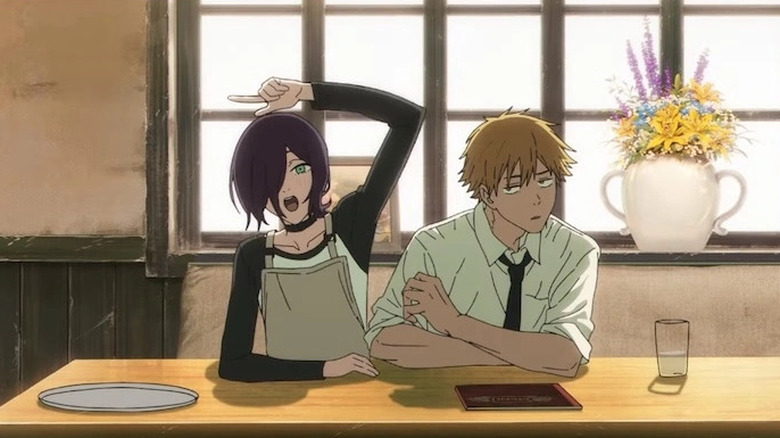 Denji and Reze sitting at a table together in Chainsaw Man - The Movie: Reze Arc