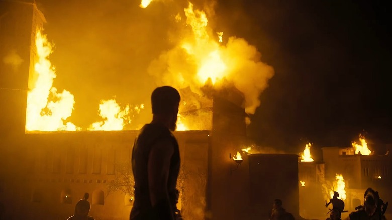 Matt Damon as Odysseus watching the city of Troy burn in The Odyssey