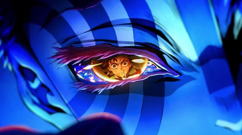 Tanjiro on the attack being reflected on the eye of the demon Akaza in Demon Slayer: Kimetsu no Yaiba - Infinity Castle