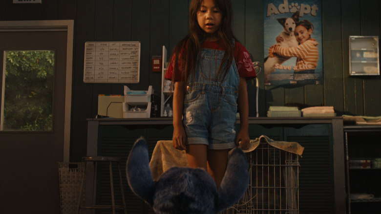 Maia Kealoha as Lilo standing up and looking down at Stitch in Lilo & Stitch (2025)