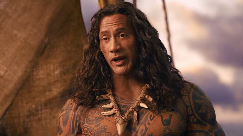 Dwayne Johnson as Maui standing on the boat with his jaw agape in Moana (2026)
