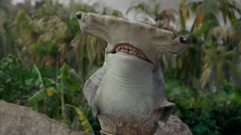 Maui, having transformed into a hammerhead shark, in Moana (2026)