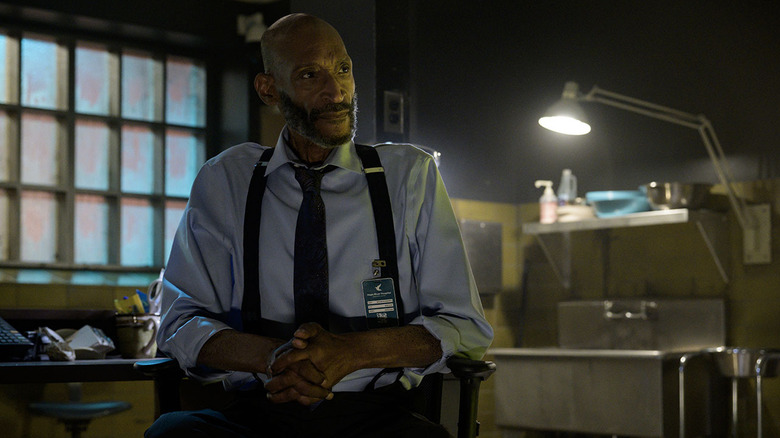 Tony Todd as William Bludworth sitting in a chair in Final Destination Bloodlines
