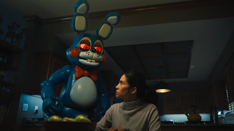 Bonnie preparing to kill a woman in her kitchen in Five Nights at Freddy's 2