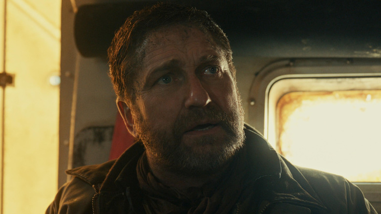Gerard Butler as John Garrity with a look of distress on his face in Greenland 2: Migration