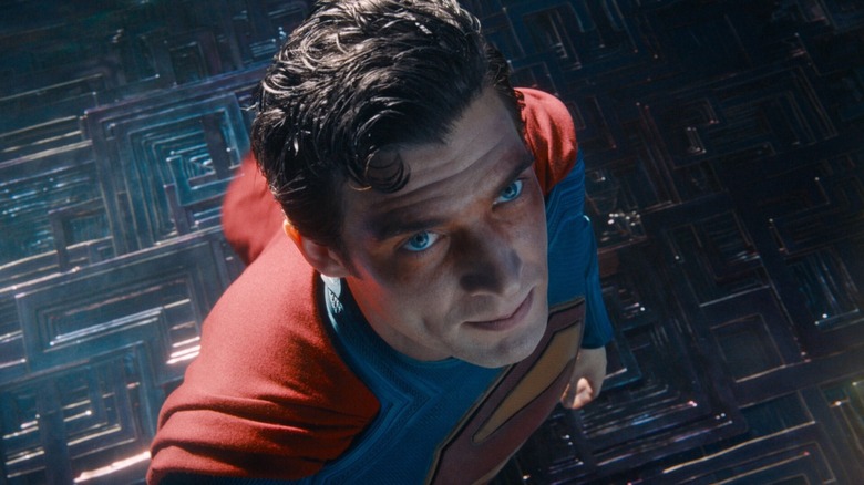 David Corenswet as Superman looking up with bruised eyes in Superman