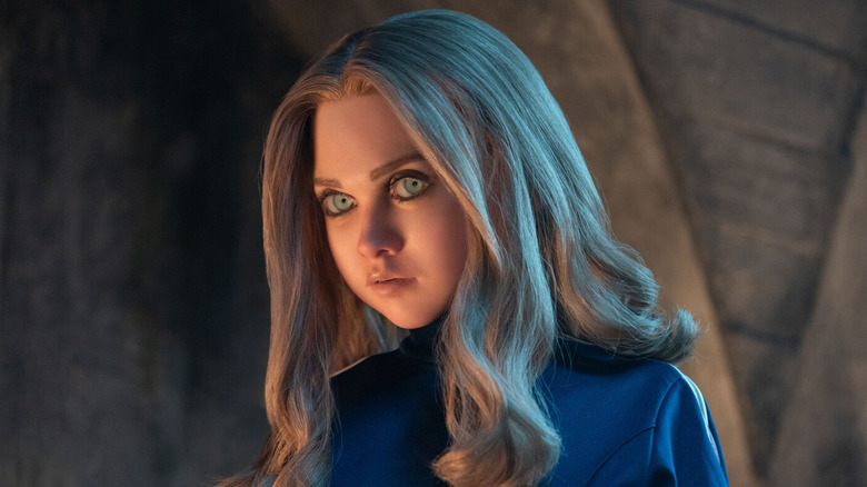 A close up of M3GAN in her blue outfit in M3GAN 2.0