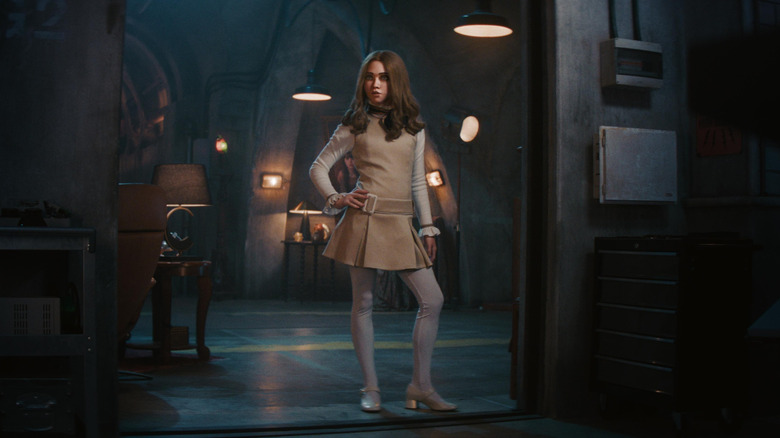 Tall M3GAN standing in the entryway in M3GAN 2.0