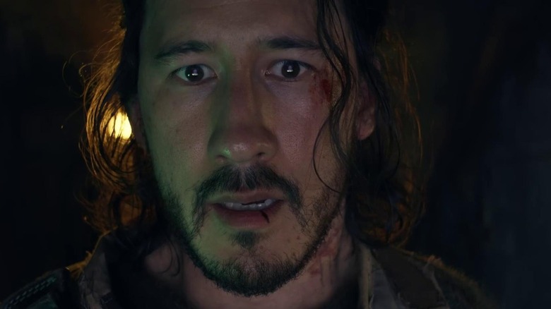 Mark Fischbach as The Convict with a look of distress on his face in Iron Lung