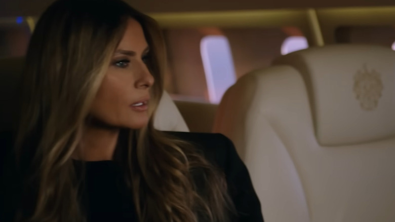 Melania Trump sitting on a plane looking out the window in Melania