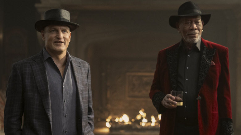 Woody Harrelson as Merritt McKinney standing with a look of wonder on his face in a mirror room in Now You See Me: Now You Don't