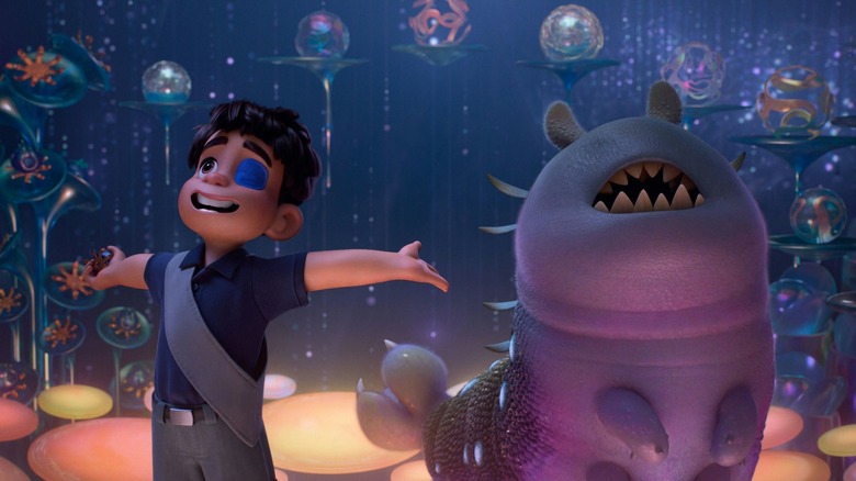 Elio gesturing with his arms alongside Glordon in Elio