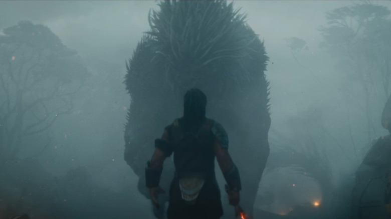 Dimitrius Schuster-Koloamatangi as Dek facing down the Kalisk in Predator: Badlands