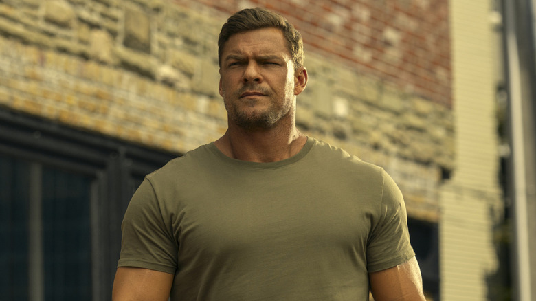 Reacher walking down a street