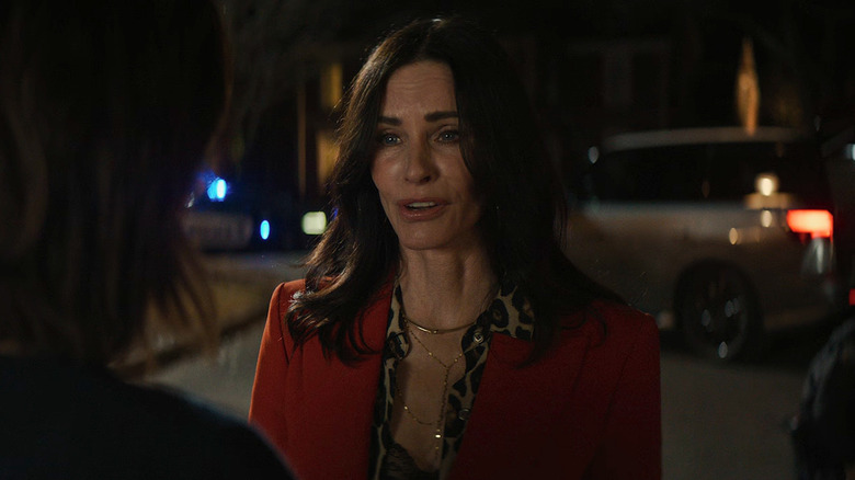 Courteney Cox as Gale talking with Sidney out in front of her house in Scream 7