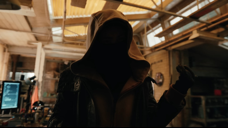 Sadie Sink as Jean Grey hidden under her cloak in Spider-Man: Brand New Day