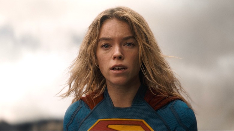 Milly Alcock as Supergirl with a sad look on her face in Supergirl