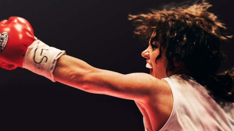 Christy Martin (Sydney Sweeney) punching a boxing glove through the air in Christy