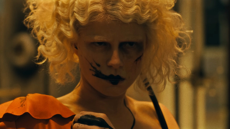 A close up of Jessie Buckley as The Bride waking up in the lab in The Bride!