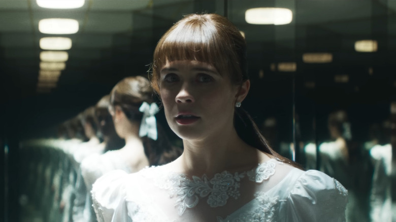 Madison Lawlor as a young Lorraine Warren in her wedding dress in The Conjuring: Last Rites