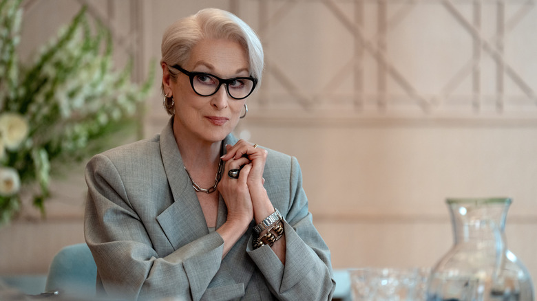 Meryl Streep as Miranda Priestly sitting at a table in The Devil Wears Prada 2