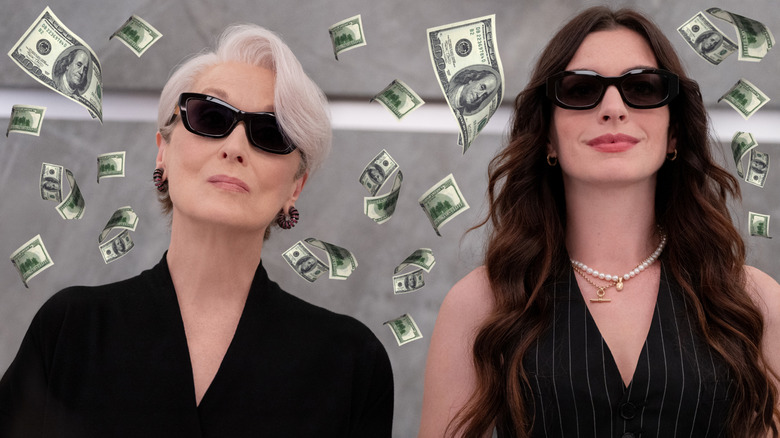 Meryl Streep as Miranda Priestly and Anne Hathaway as Andy Sachs in an elevator surrounded by money in The Devil Wears Prada 2
