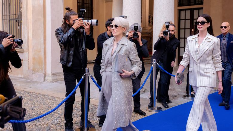 Meryl Streep as Miranda Priestly and Anne Hathaway as Andy Sachs walking down the runway in The Devil Wears Prada 2