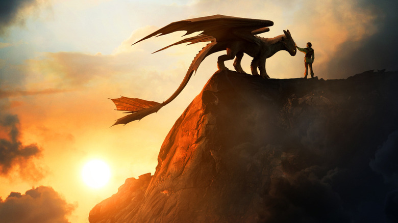 Hiccup petting Toothless on the poster for How to Train Your Dragon (2025)