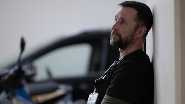 Robby leaning against a wall on The Pitt