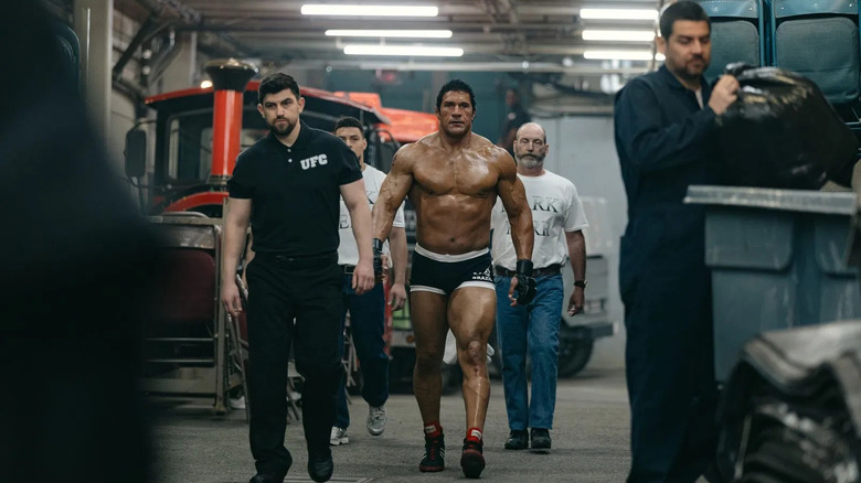 Dwayne Johnson as Mark Kerr marching towards a match in The Smashing Machine