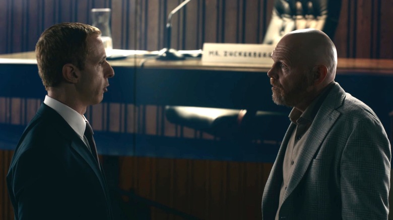 Jeremy Strong as Mark Zuckerberg talking with Bill Burr as Charlie in The Social Reckoning