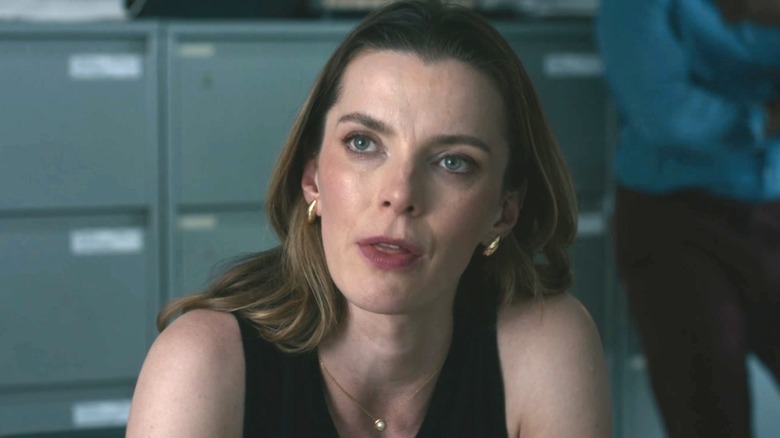 Betty Gilpin as Christina sitting in an office in The Social Reckoning