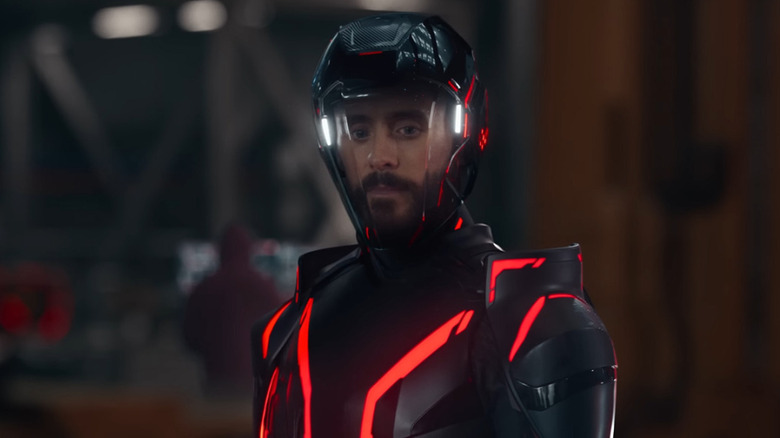 Jared Leto as Ares looking down in his helmet in Tron: Ares