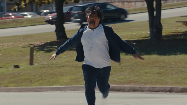 Benedict Wong as Marcus running with blood all over his face in Weapons