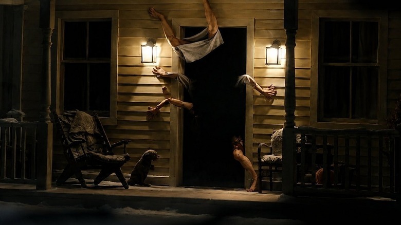 Hands and legs coming out of a doorway in Resident Evil (2026)