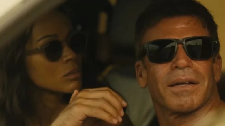 Zoe Saldaña and Taylor Sheridan as Joe and Cody both wearing sunglasses