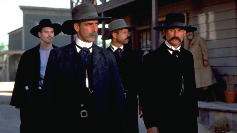 Virgil (Sam Elliott) and Wyatt Earp (Kurt Russell) standing in a town in "Tombstone."