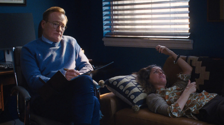 Linda on a couch talking to her indifferent therapist in If I Had Legs I'd Kick You